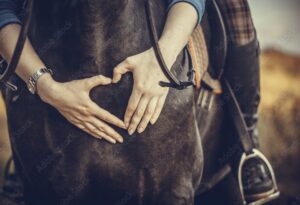 Horse Rider hugging horse around the neck